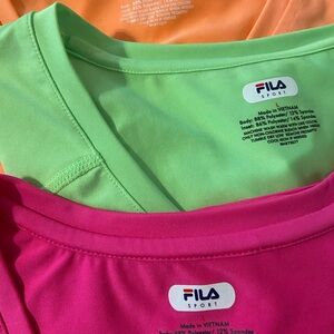 Three women’s Large pickleball bright exercise tops. No stains, holes, or snags.